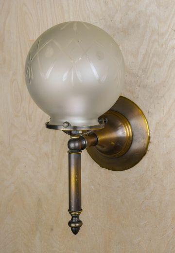One Light Torch Style Wall Sconce With Frosted Globe Shade